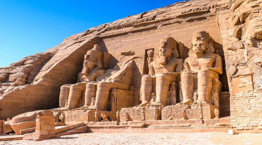 Front view of Abu Simbel Temples with massive statues of Ramses II in Aswan, Egypt